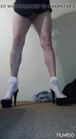 Mature posing in socks and heels