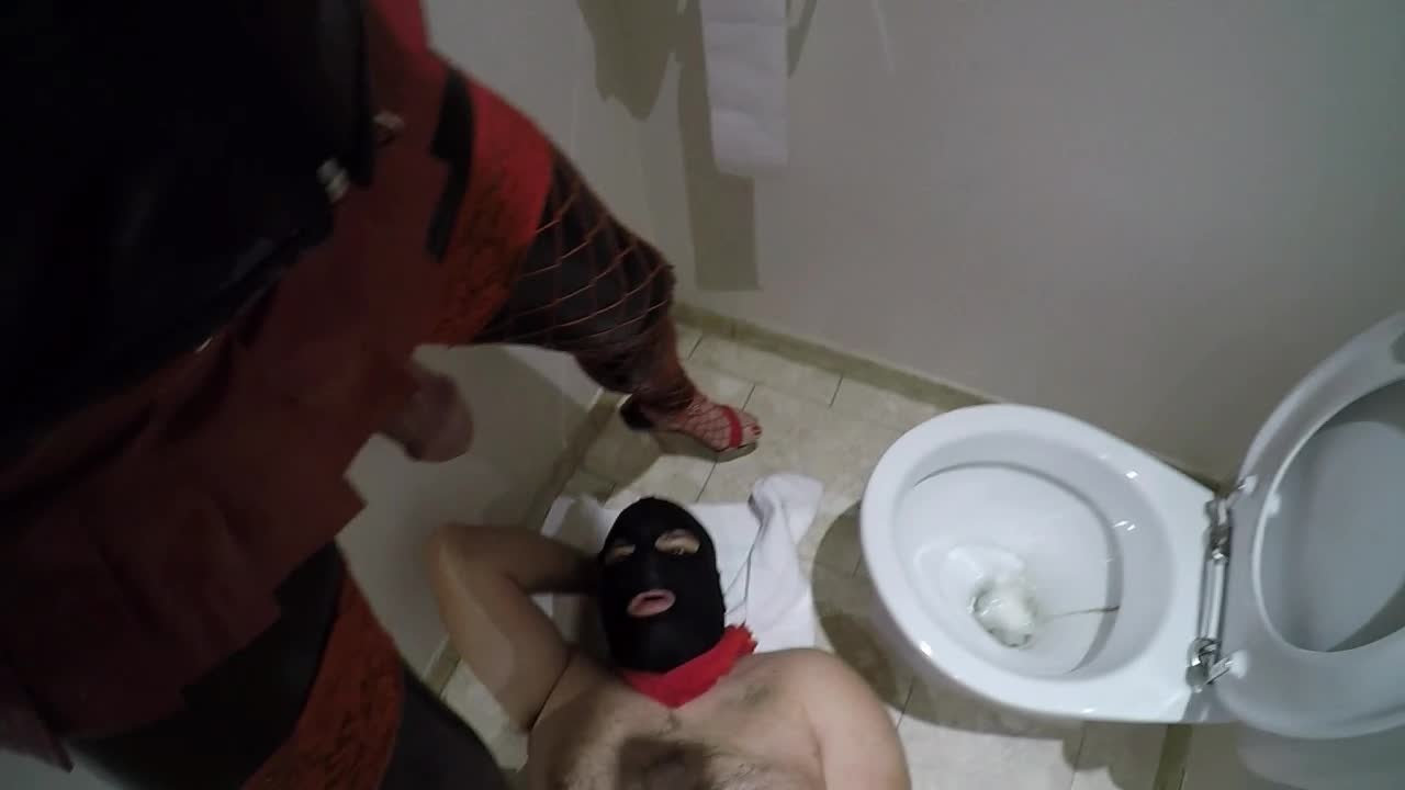 Pissing on slave in bathroom