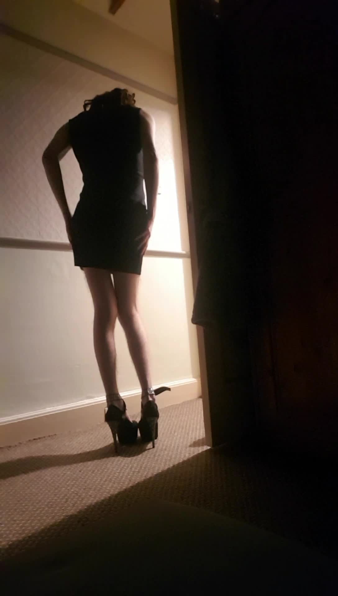 Skinny sissy in tight black dress and heels